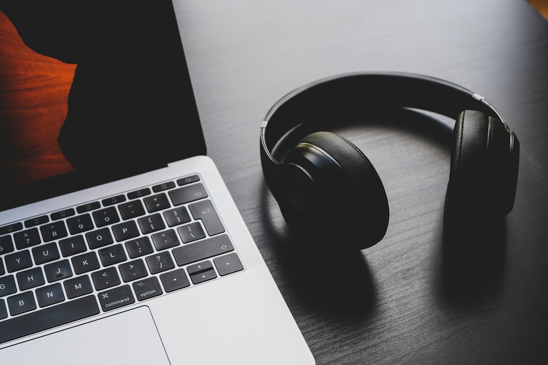 Representative headphones and laptop workspace